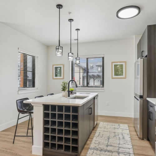 B2A Model Kitchen Modern kitchen with island at Solace at the Ranch apartments for rent in Colorado Springs.