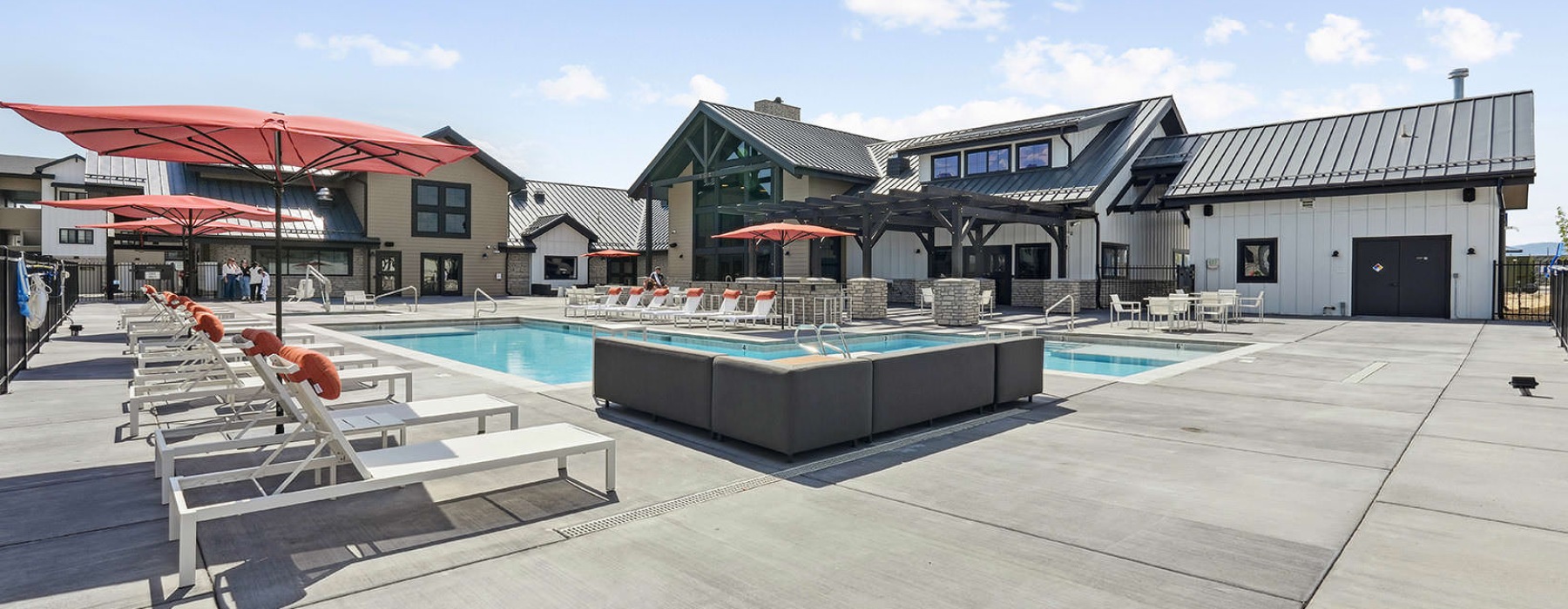 lounge areas surround outdoor swimming pool